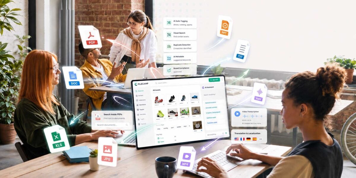 Collaborative team using Filecamp digital asset management platform on computer.